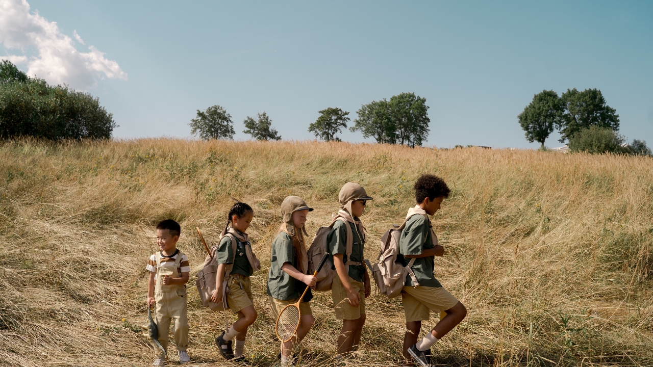 kids hiking on a hill